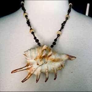Fun and funky necklace with real shell.